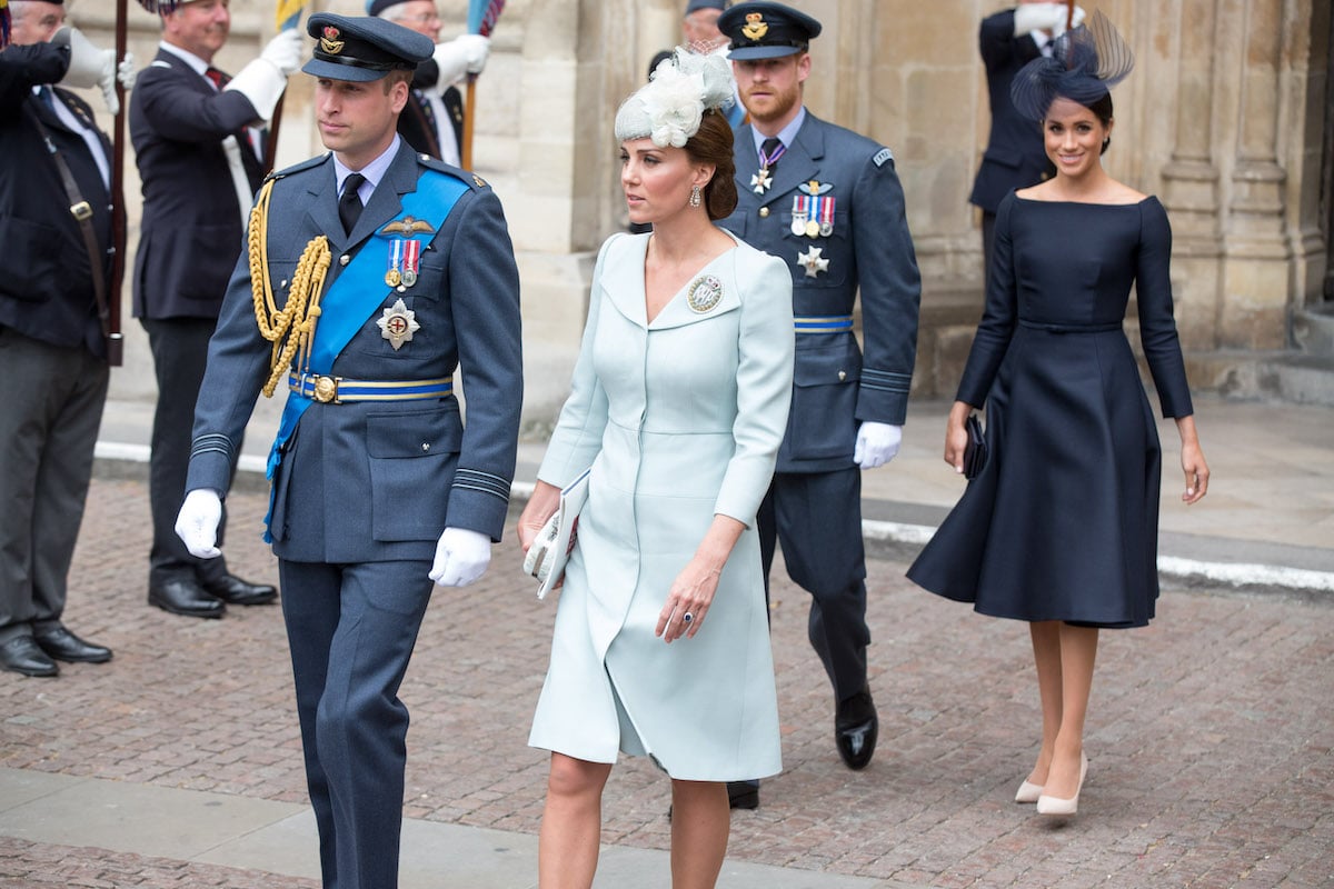 Prince William and Kate Middleton, who received advice to do 'less listening and learning' upon Meghan Markle's arrival, walk with Prince Harry and Meghan Markle