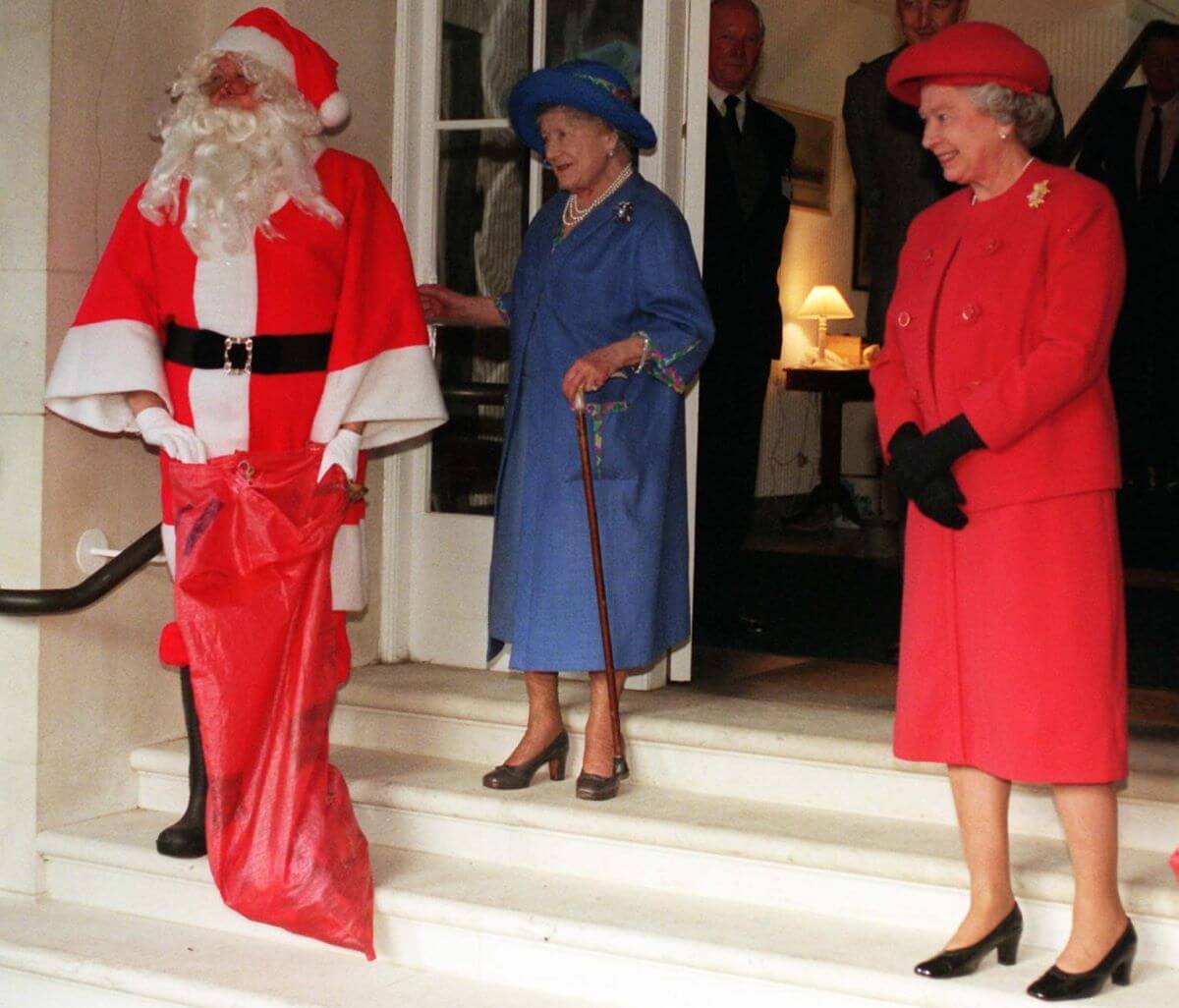 Queen Elizabeth II and her mom, The Queen Mother, ready to assist Santa as he prepare to give out gifts
