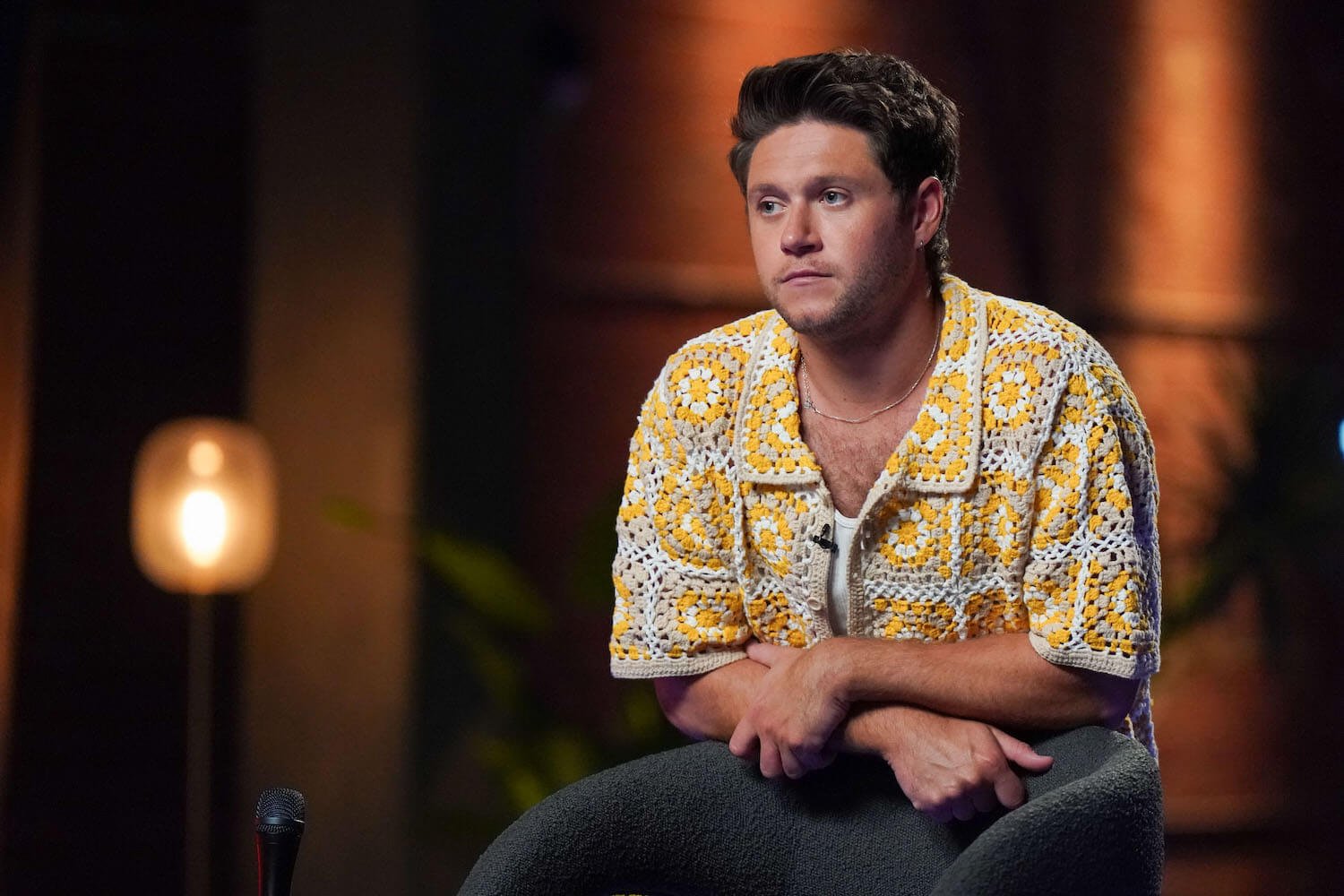 'The Voice' Season 24 star Niall Horan sitting and looking pensive