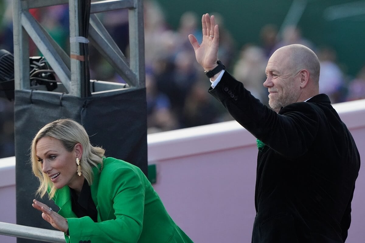 Zara Tindall and Mike Tindall wave during the King Charles III's Coronation Concert in Windsor, England