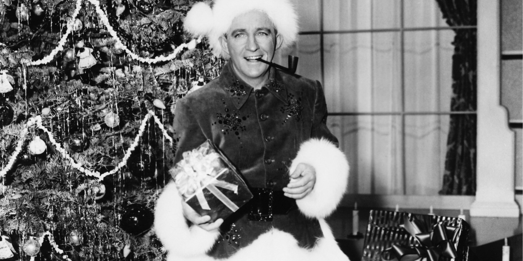 Bing Crosby dressed as Santa Claus in the feature film 'White Christmas' based on the song of the same name.