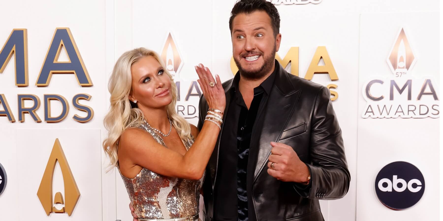 Catherine Boyer and Luke Bryan pose on the red carpet at the CMA Awards.