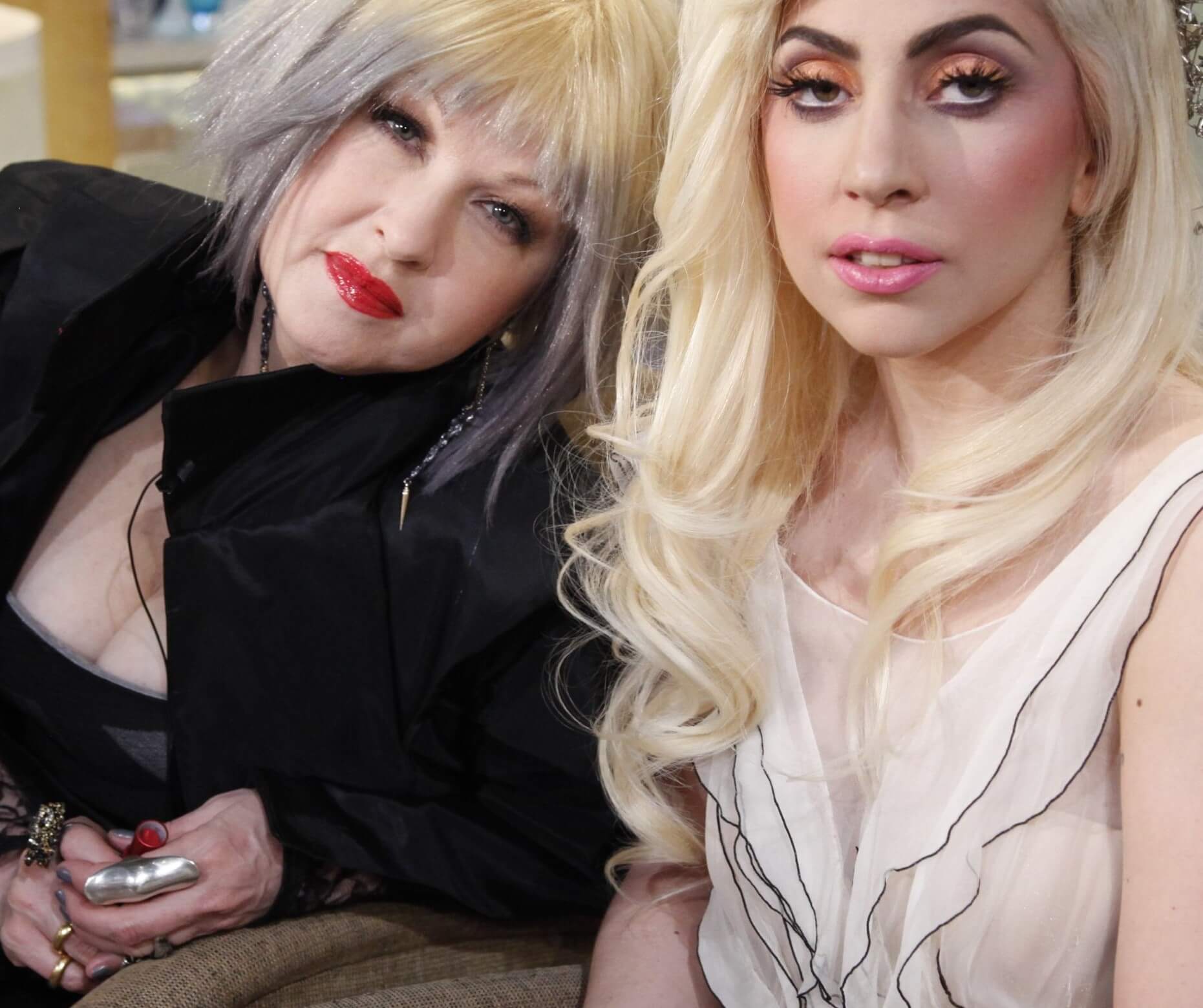 Cyndi Lauper sitting with Lady Gaga