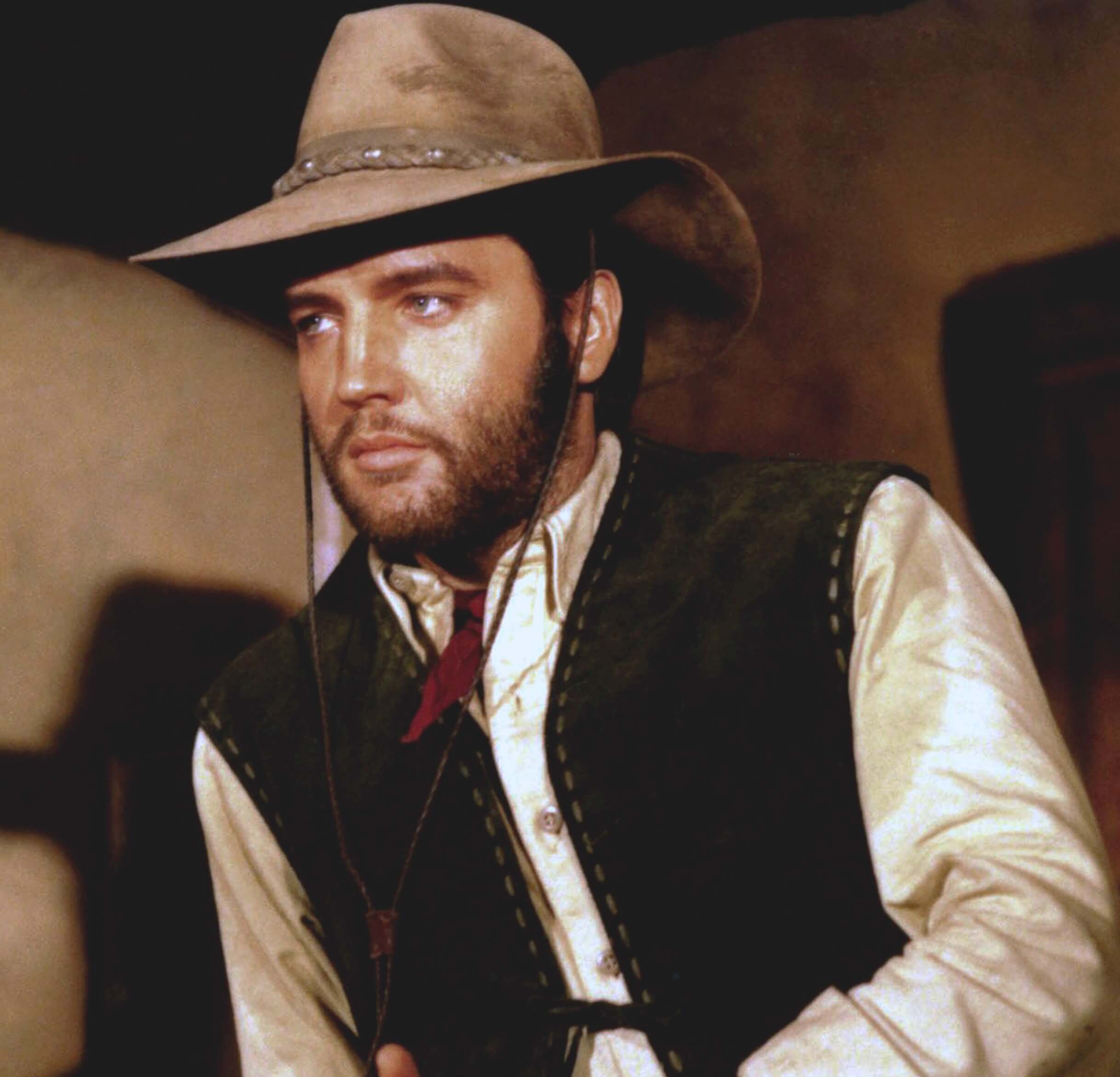 Elvis Presley dressed as a cowboy
