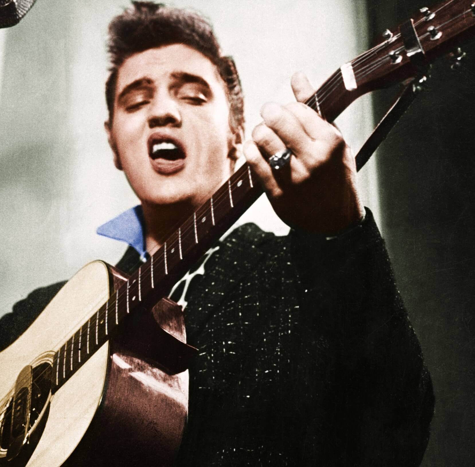 Gospel singer Elvis Presley with a guitar