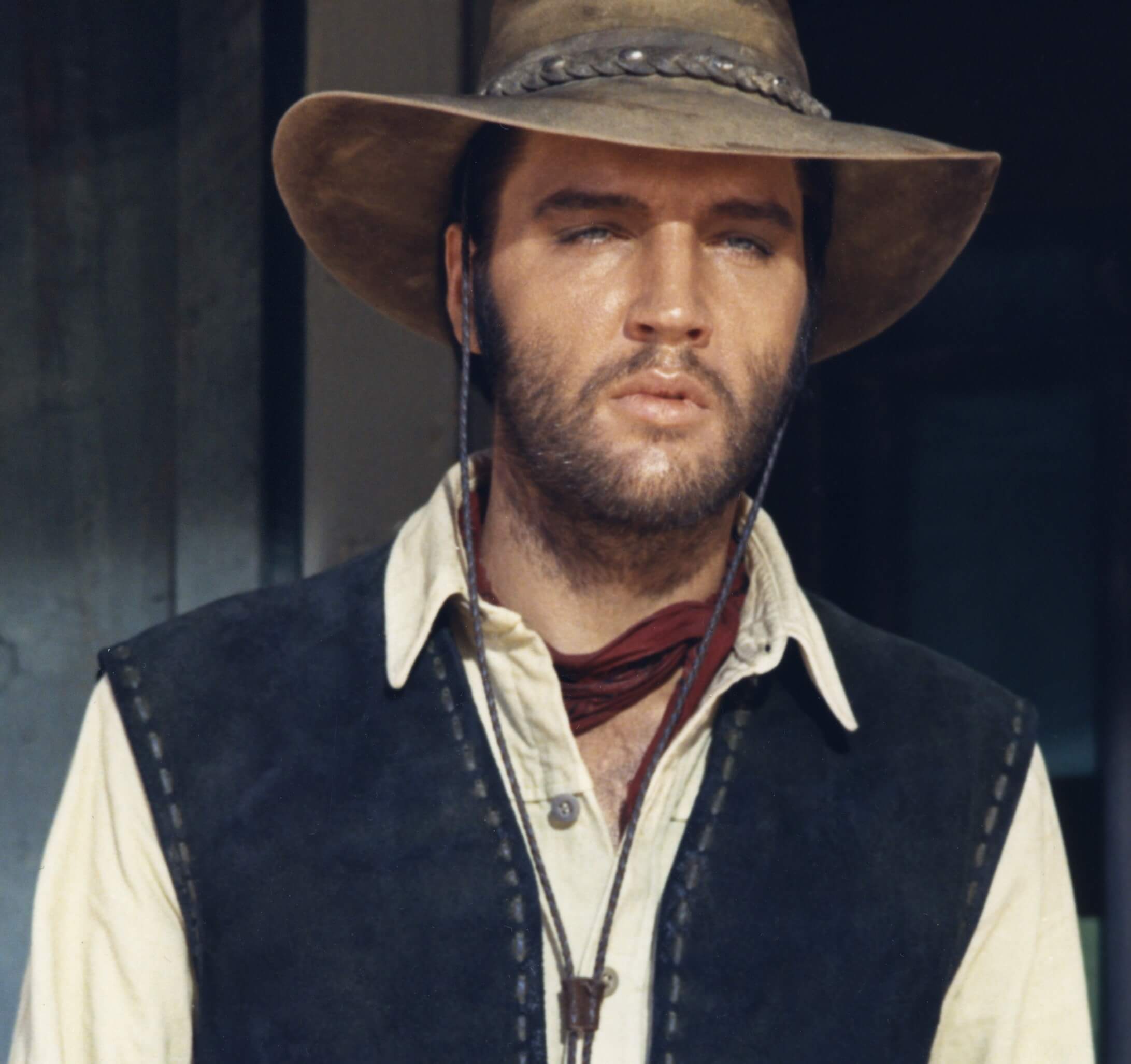 Elvis Presley dressed as a cowboy