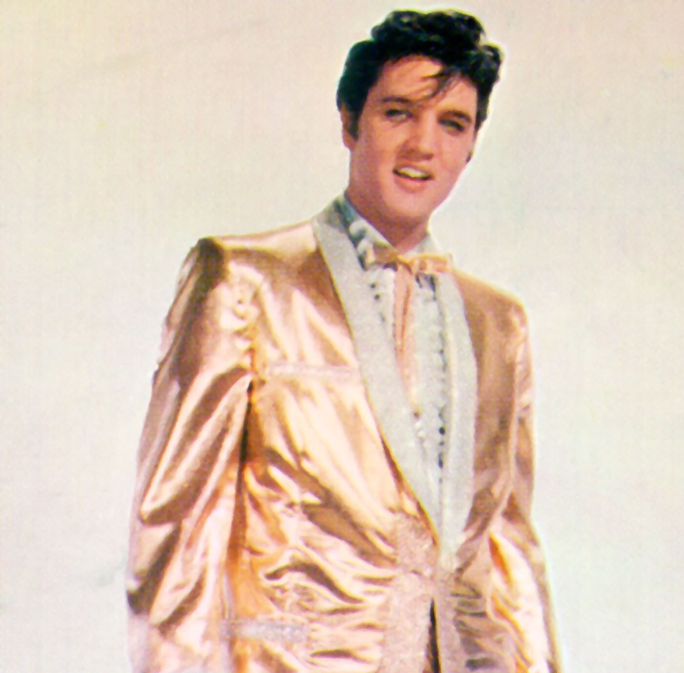 Elvis Presley in a gold suit