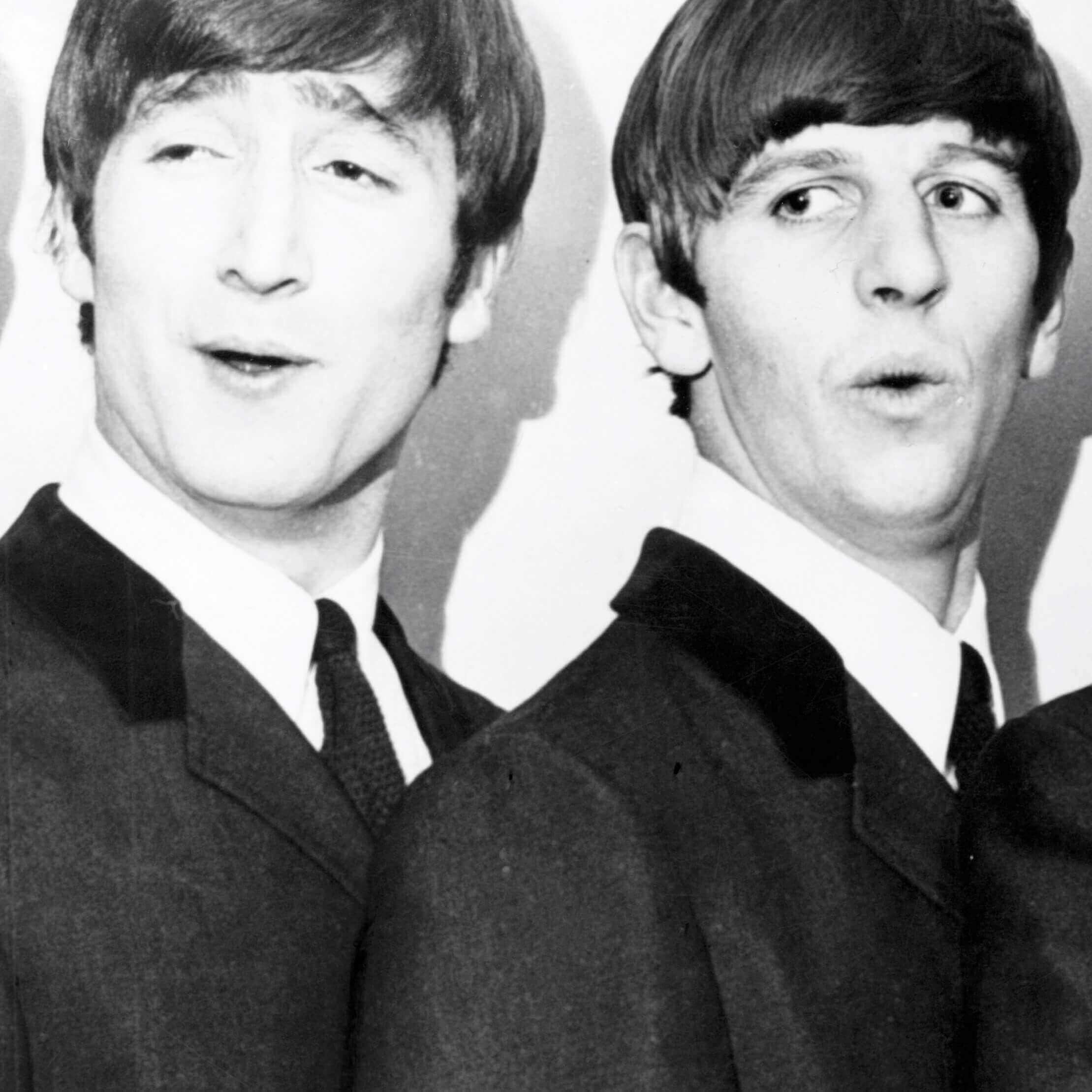 John Lennon and Ringo Starr wearing suits