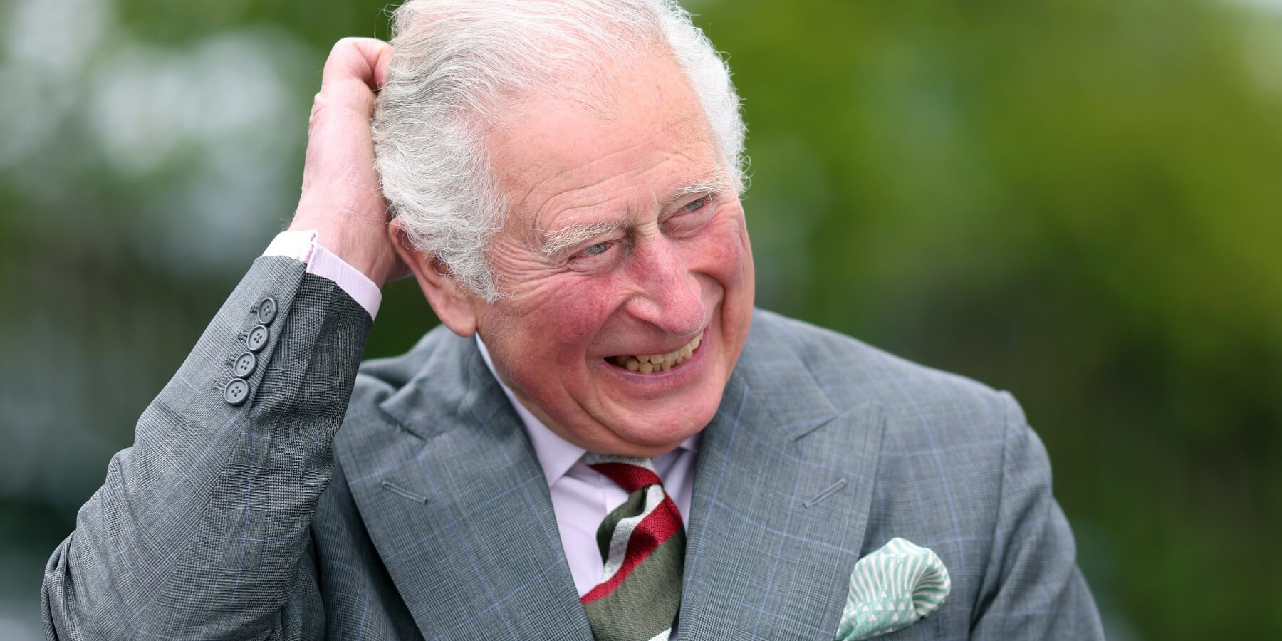 King Charles is photographed laughing on May 14, 2021 in Cardiff, United Kingdom.