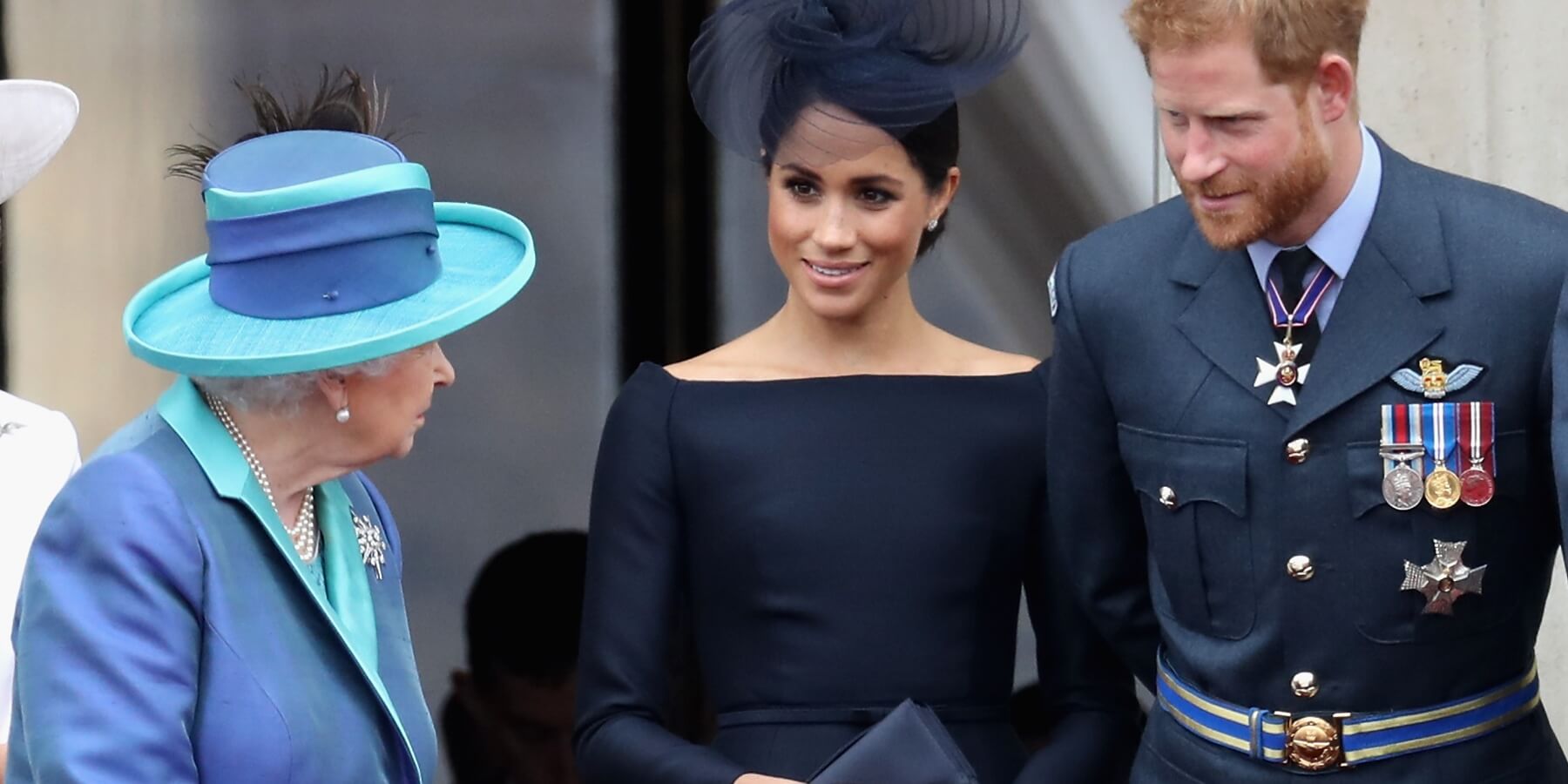 Queen Elizabeth, Meghan Markle and Prince Harry mark the centenary of the RAF on July 10, 2018 in London, England.