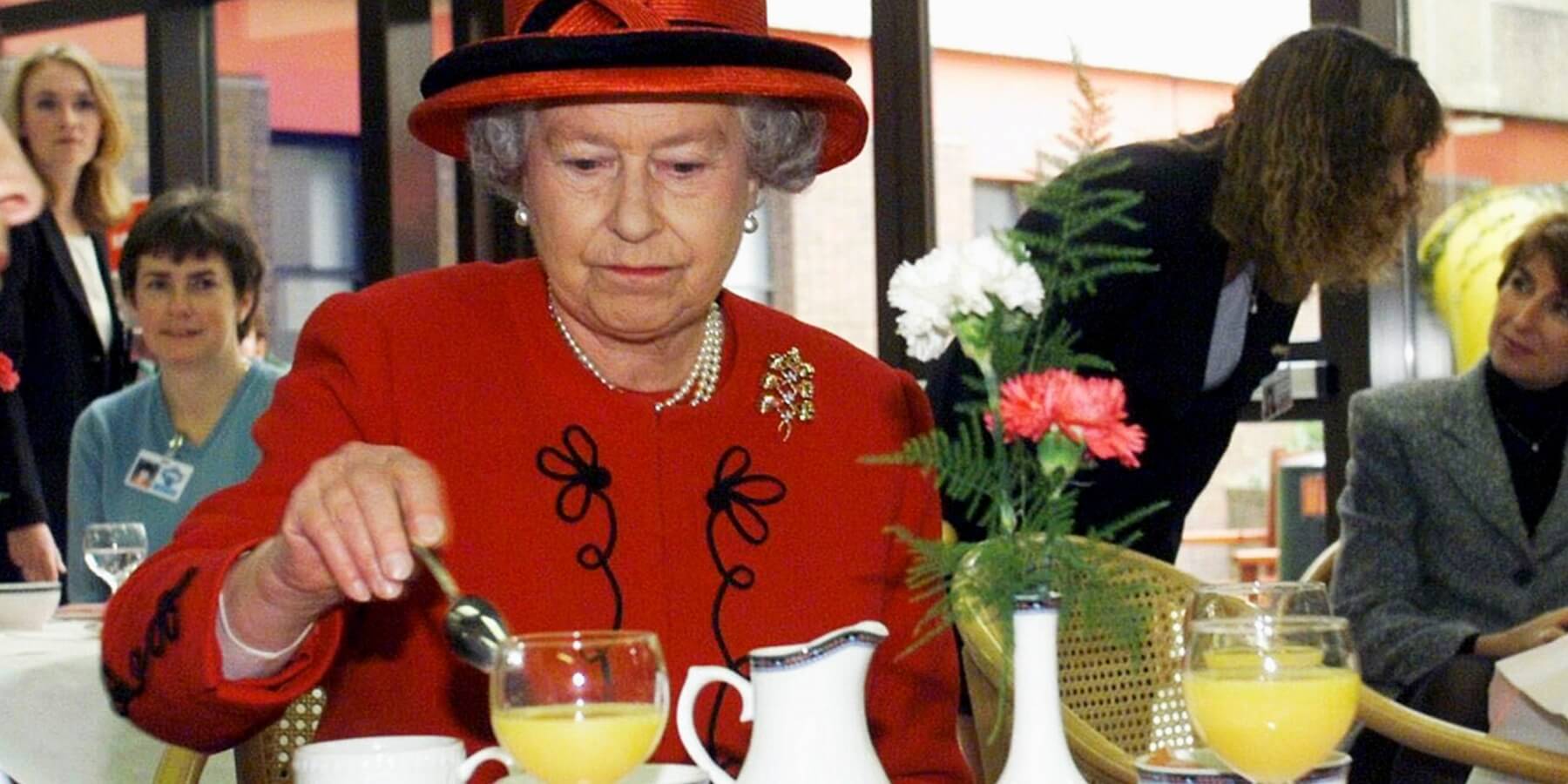 Queen Elizabeth photographed enjoying afternoon tea in 1999.