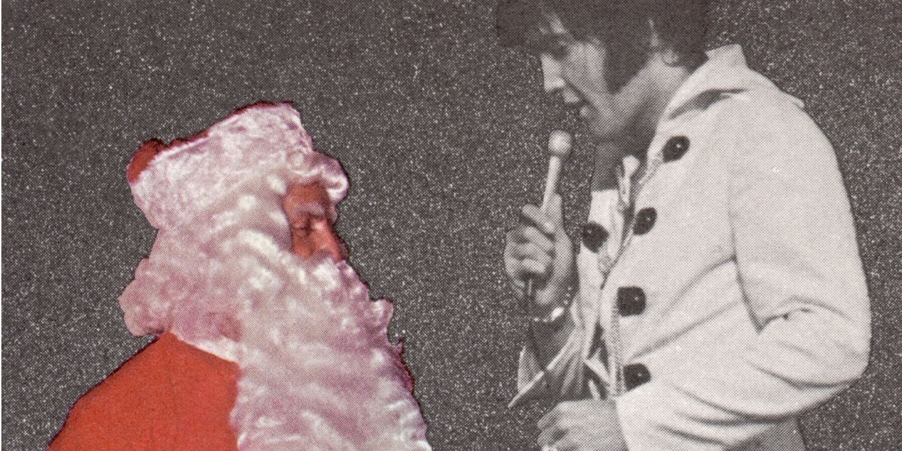 Colonel Tom Parker dressed as Santa Claus with Elvis Presley.