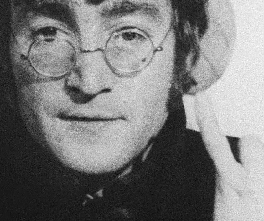 A 1960s image of The Beatles' John Lennon in black-and-white