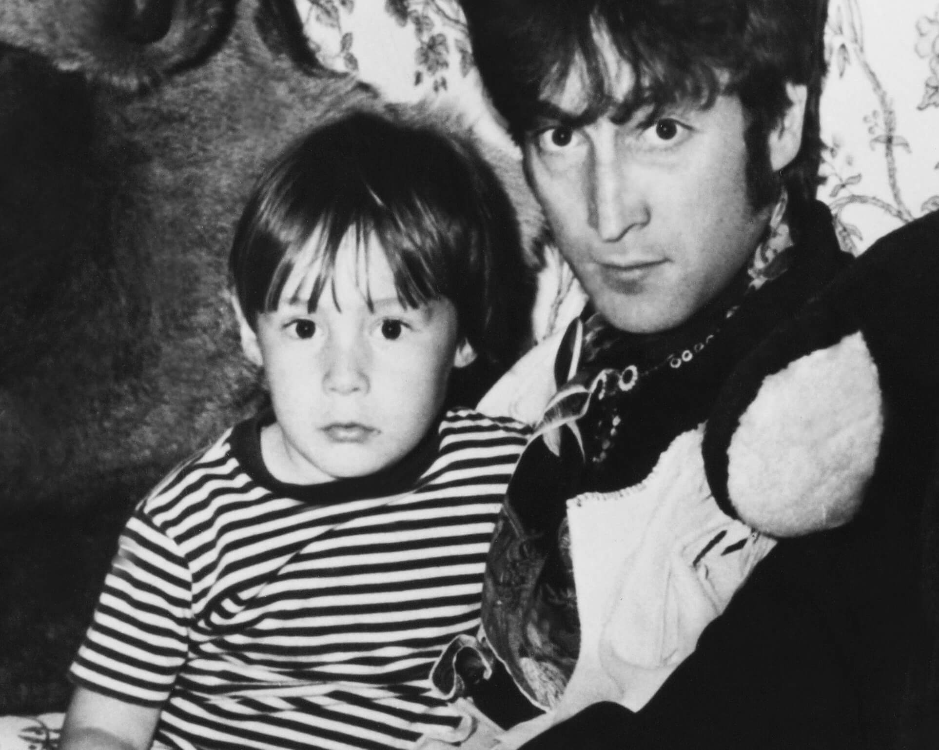 The Beatles' John Lennon holding his son, Julian Lennon