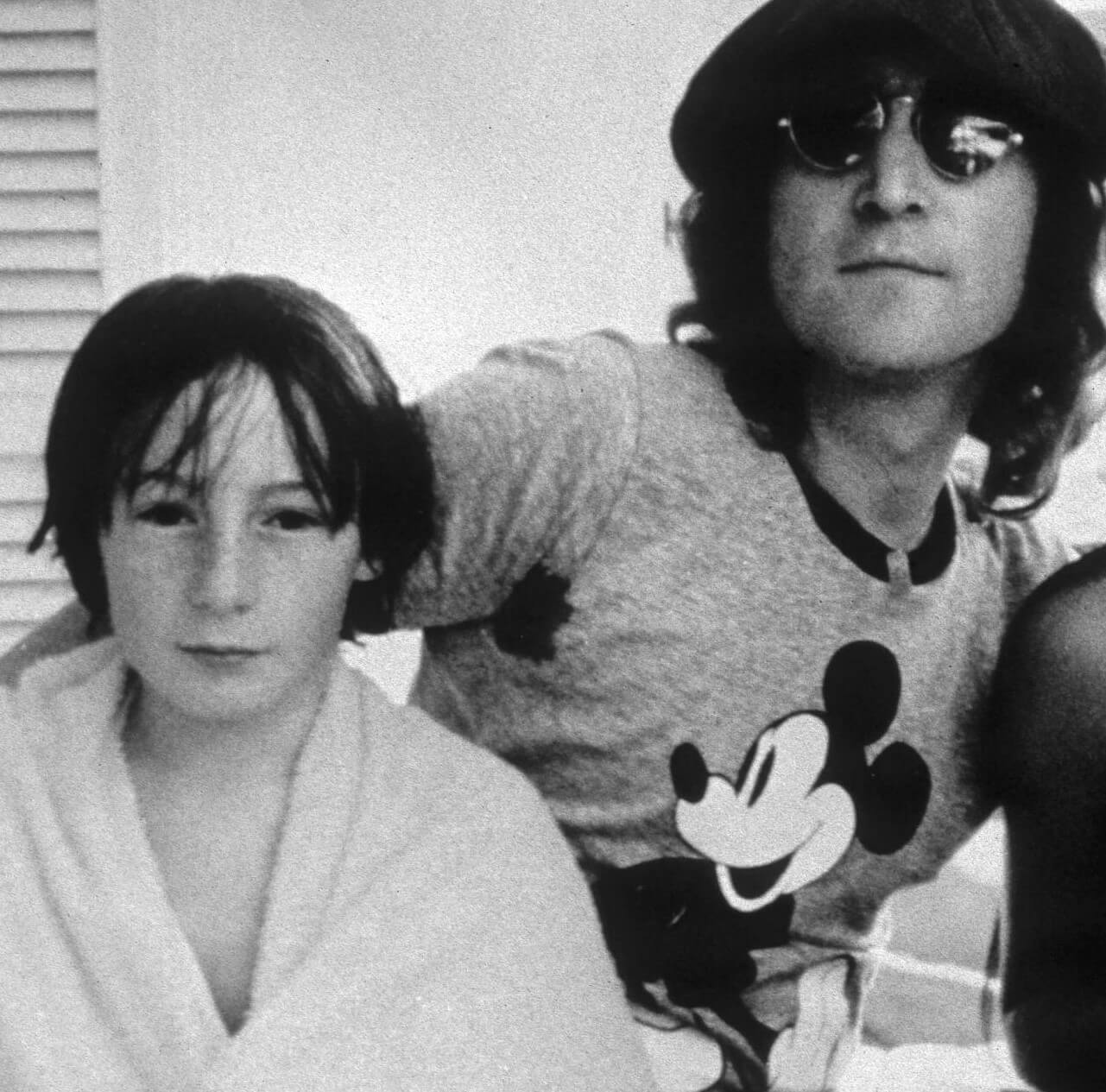 A black and white picture of John Lennon and his son, Julian Lennon, in black-and-white