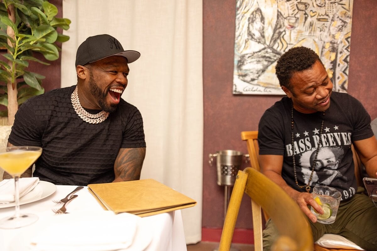 50 Cent and Cuba Gooding Jr. sitting next to each other.