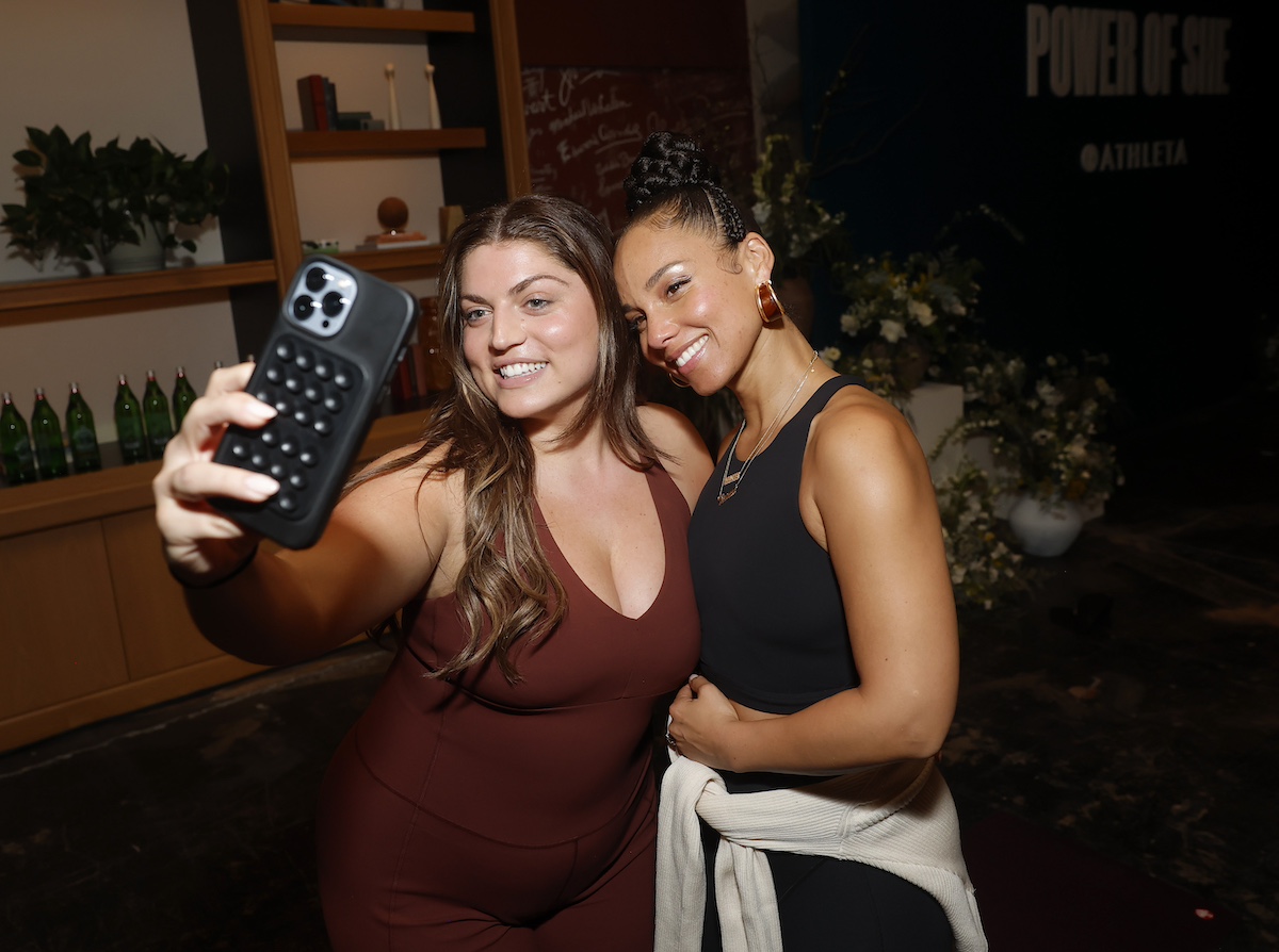 A fan takes a selfie with Alicia Keys