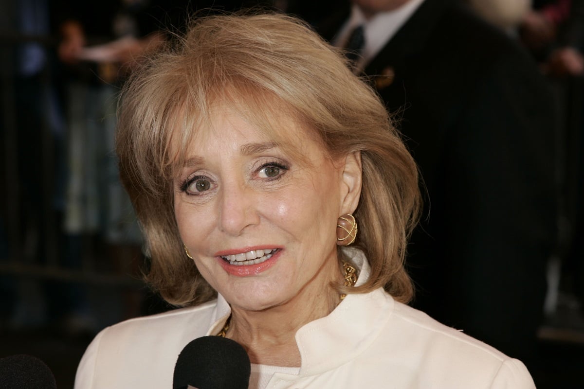 Barbara Walters posing while wearing white clothes at the New Amsterdam theater for the Dana Reeve Memorial Service