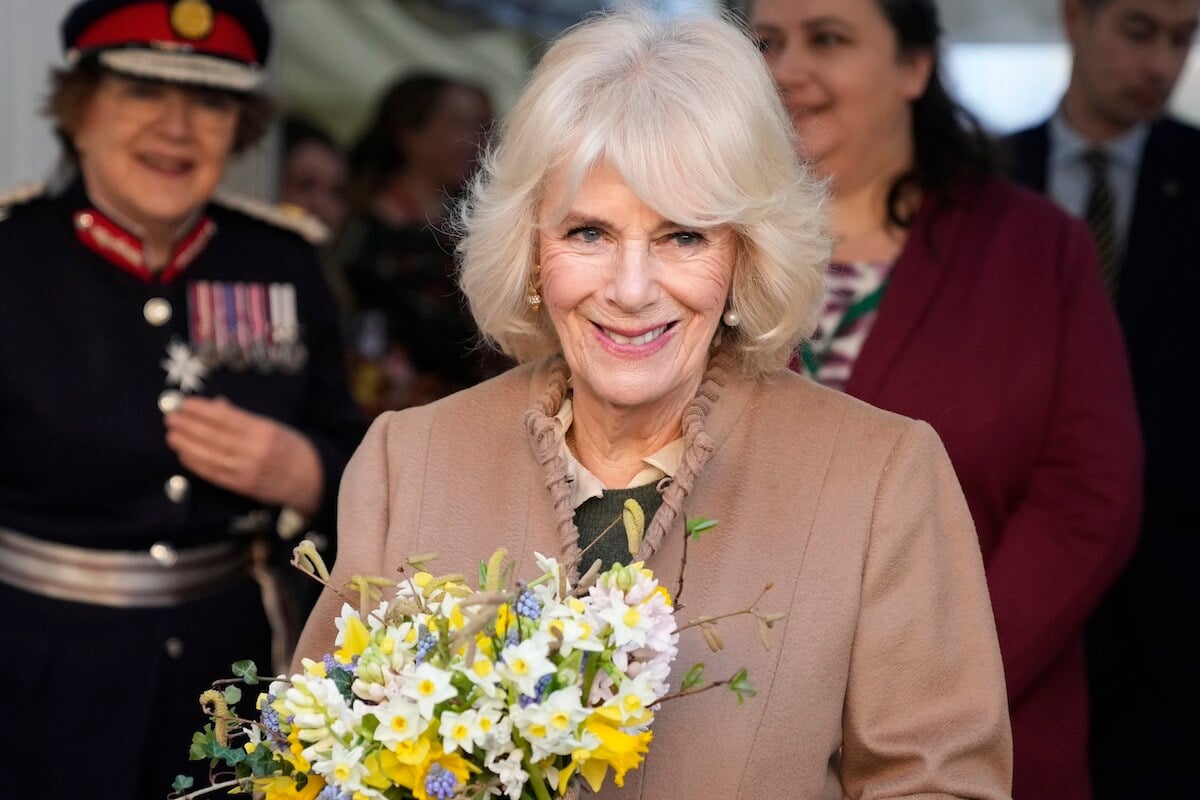 Queen Camilla holding flowers