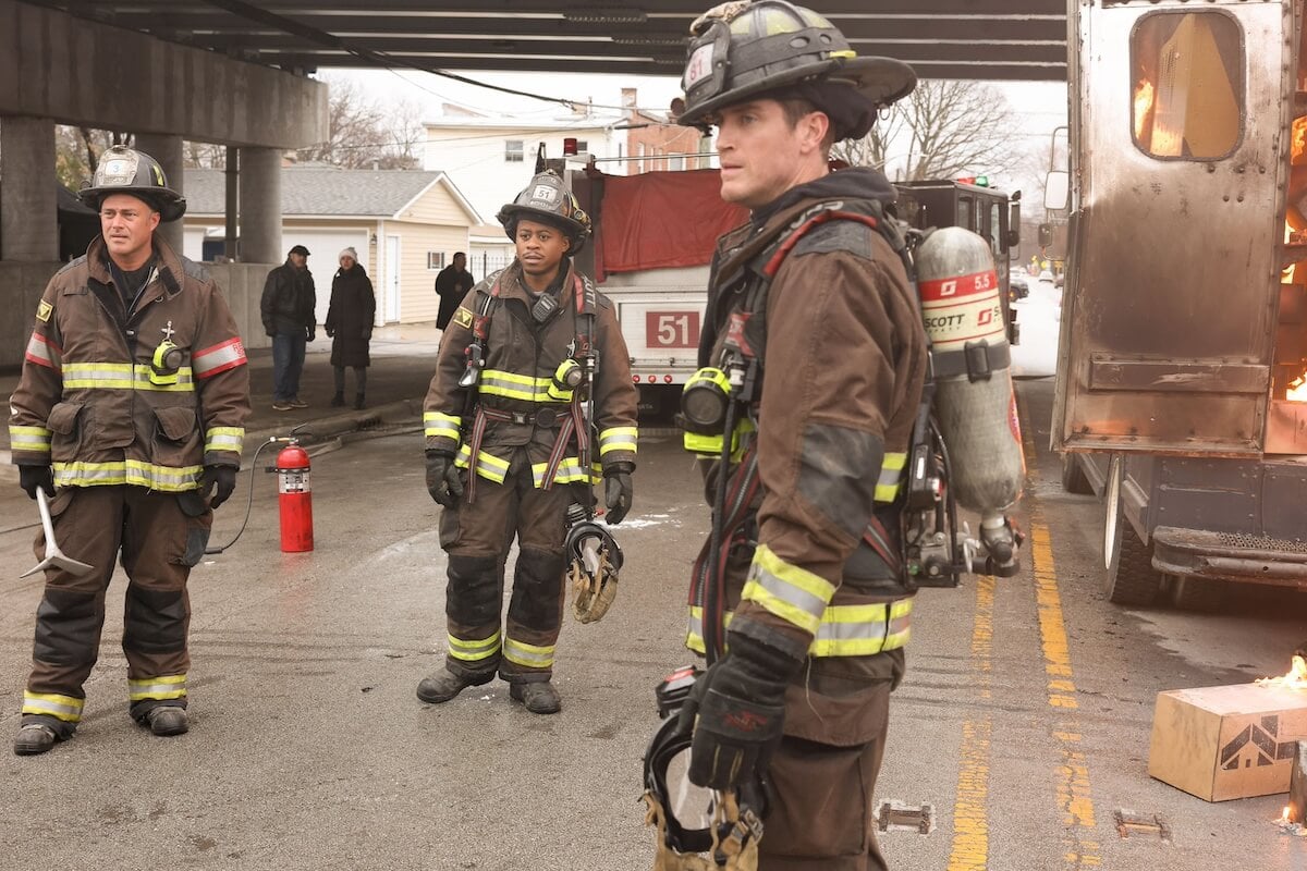 Severide, Ritter, and Carver standing on a street and wearing firefighter gear in the 'Chicago Fire' Season 12 premiere