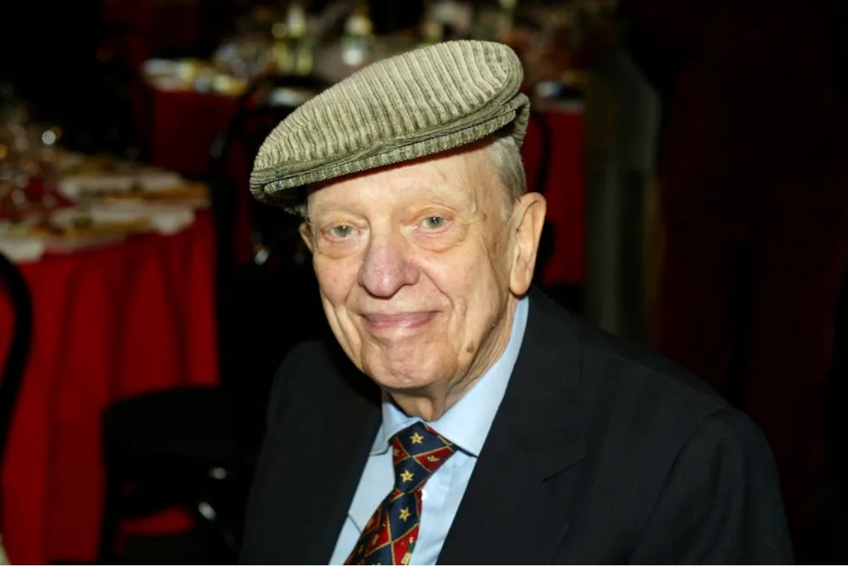Don Knotts posing in a brown hat and suit.