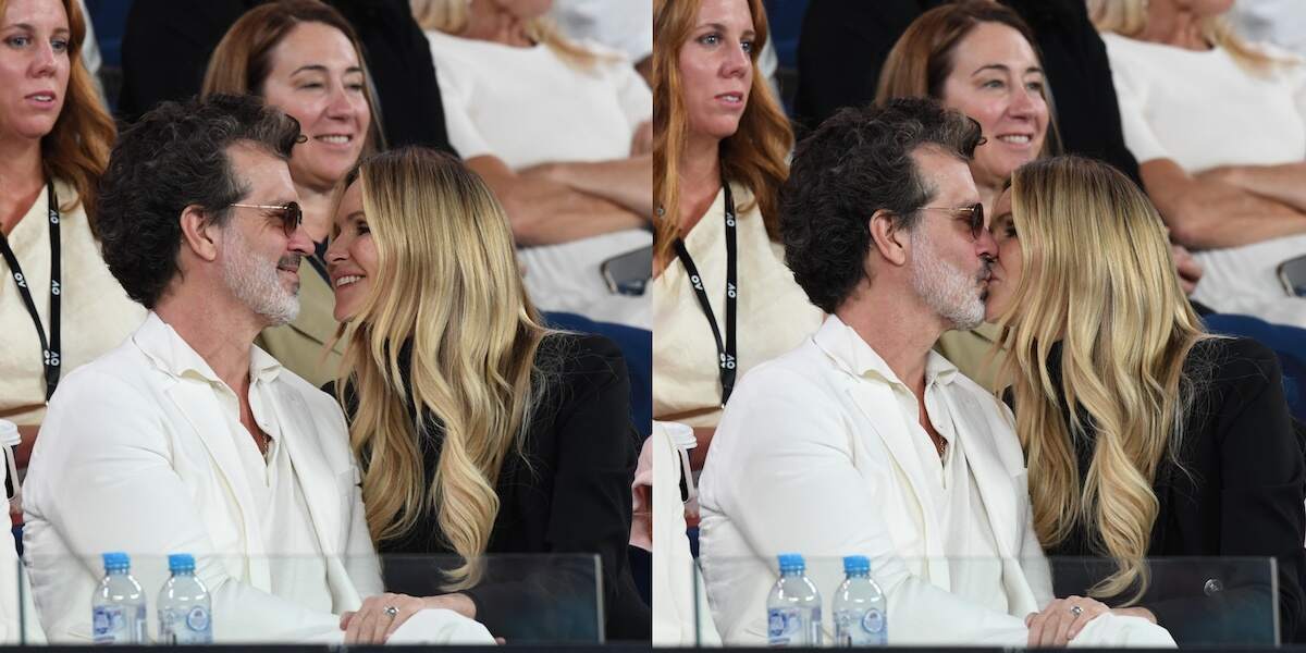Doyle Bramhall and Elle Macpherson kiss as fans cheer them on at the 2024 Australian Open from the stands