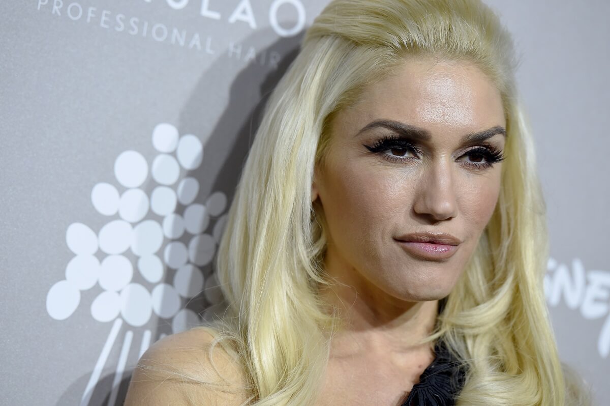 Gwen Stefani posing at the 2015 Baby2Baby Gala in a dress.