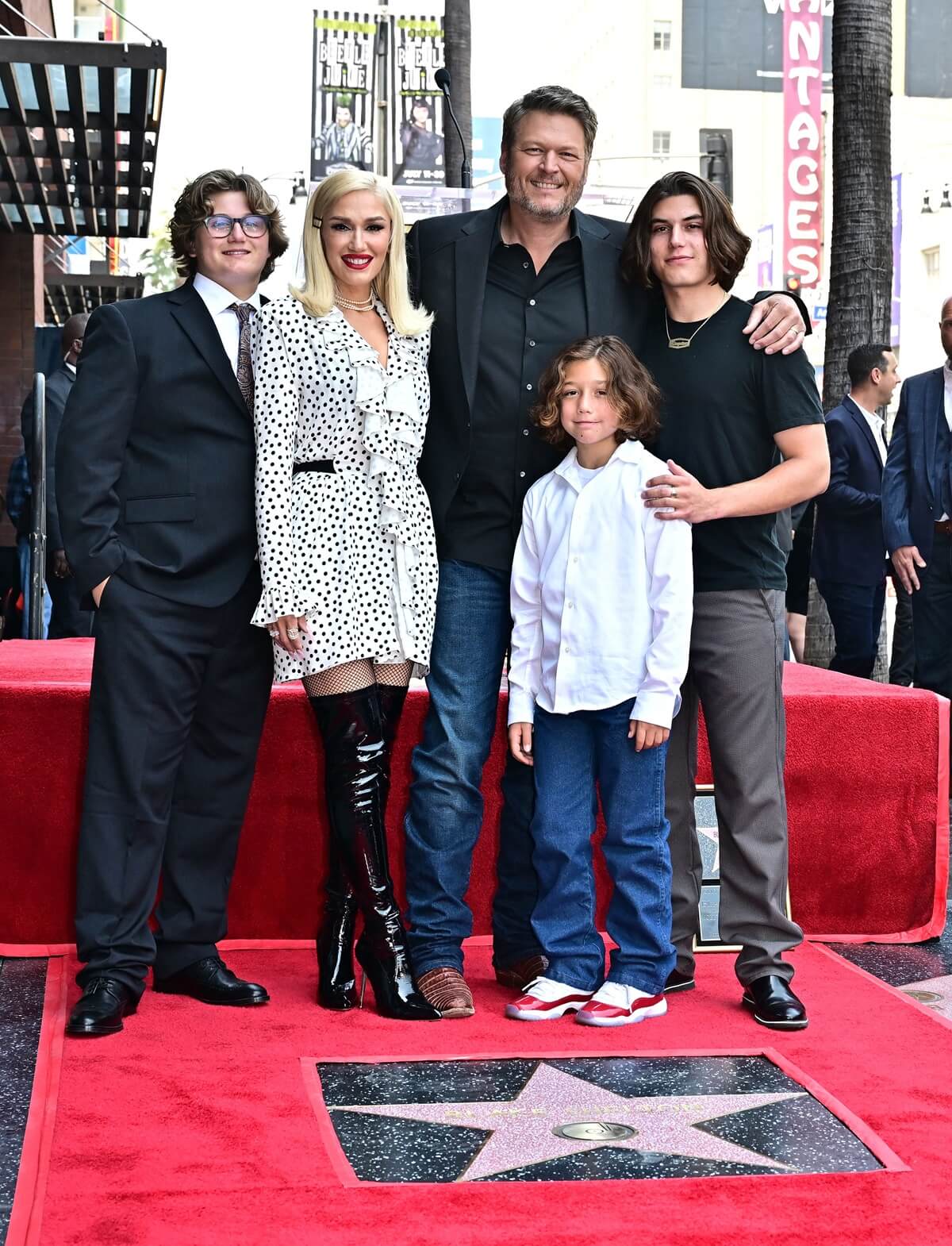 Gwen Stefani posing with her husband Blake Shelton and children at the Hollywood Walk of Fame ceremony.