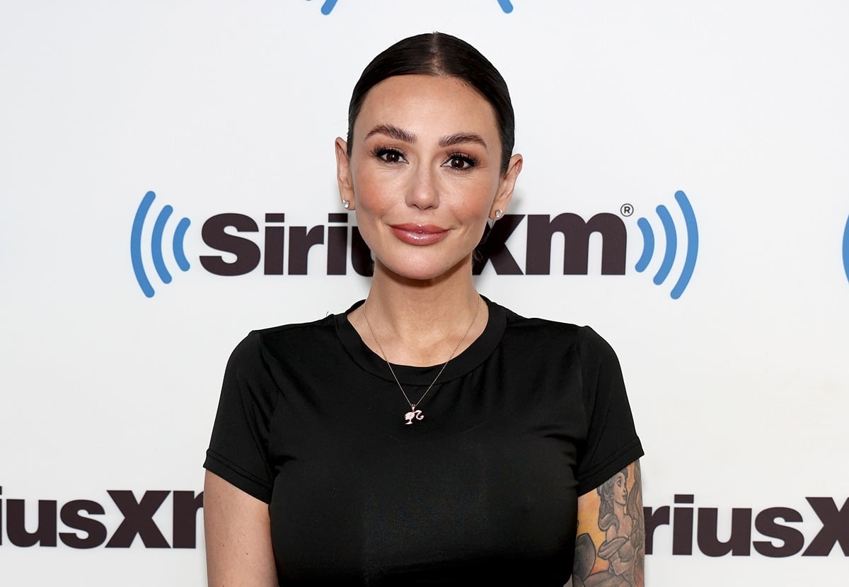 Jenni 'JWoww' Farley posing in a black t-shirt at Sirius XM.