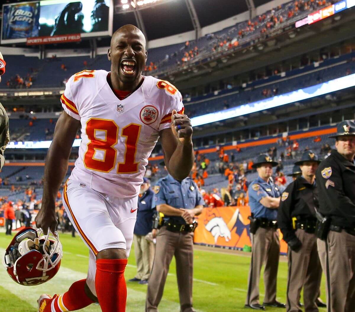 Jason Avant celebrates as he runs off the field following a win against the Denver Broncos