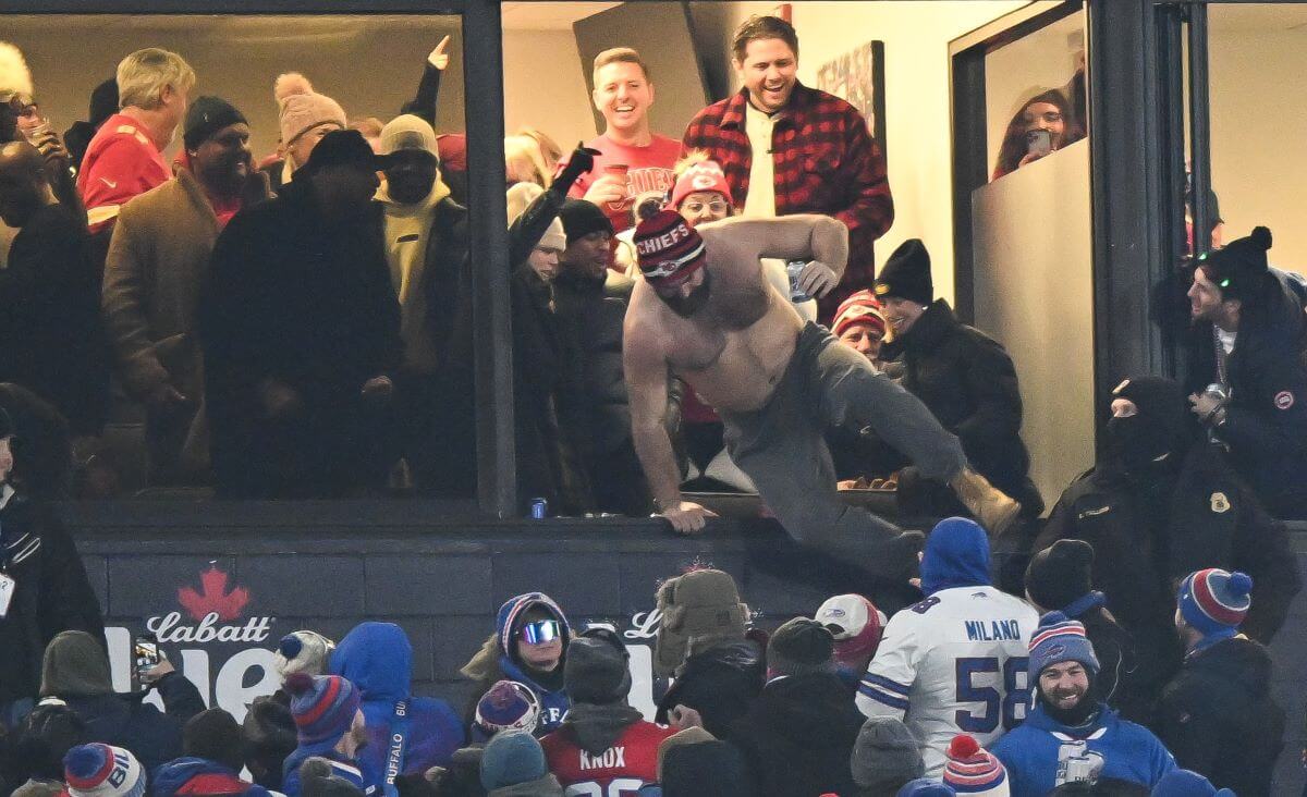 Jason Kelce celebrates and jumps from his box after the Kansas City Chiefs score a touchdown in the AFC Divisional Playoff game against the Buffalo Bills