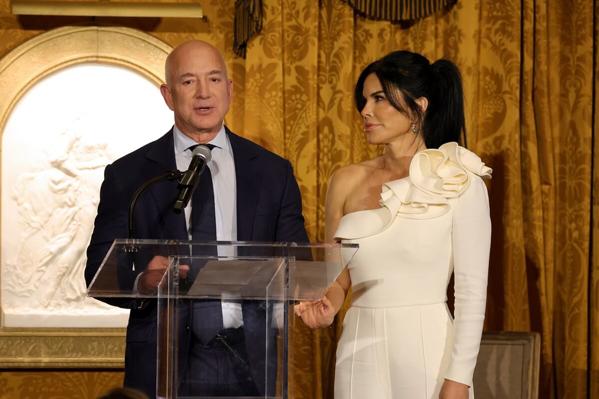 Jeff Bezos and Lauren Sanchez speaking on stage during the IWMF Courage in Journalism Awards