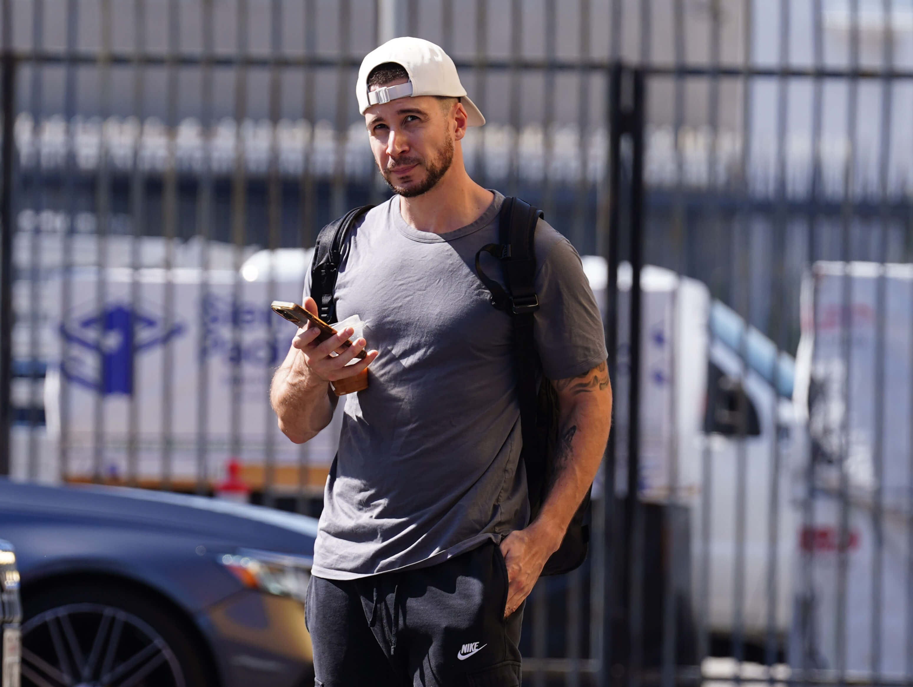 'Jersey Shore: Family Vacation' star Vinny Guadagnino sighted wearing a backwards hat and backpack while holding his phone