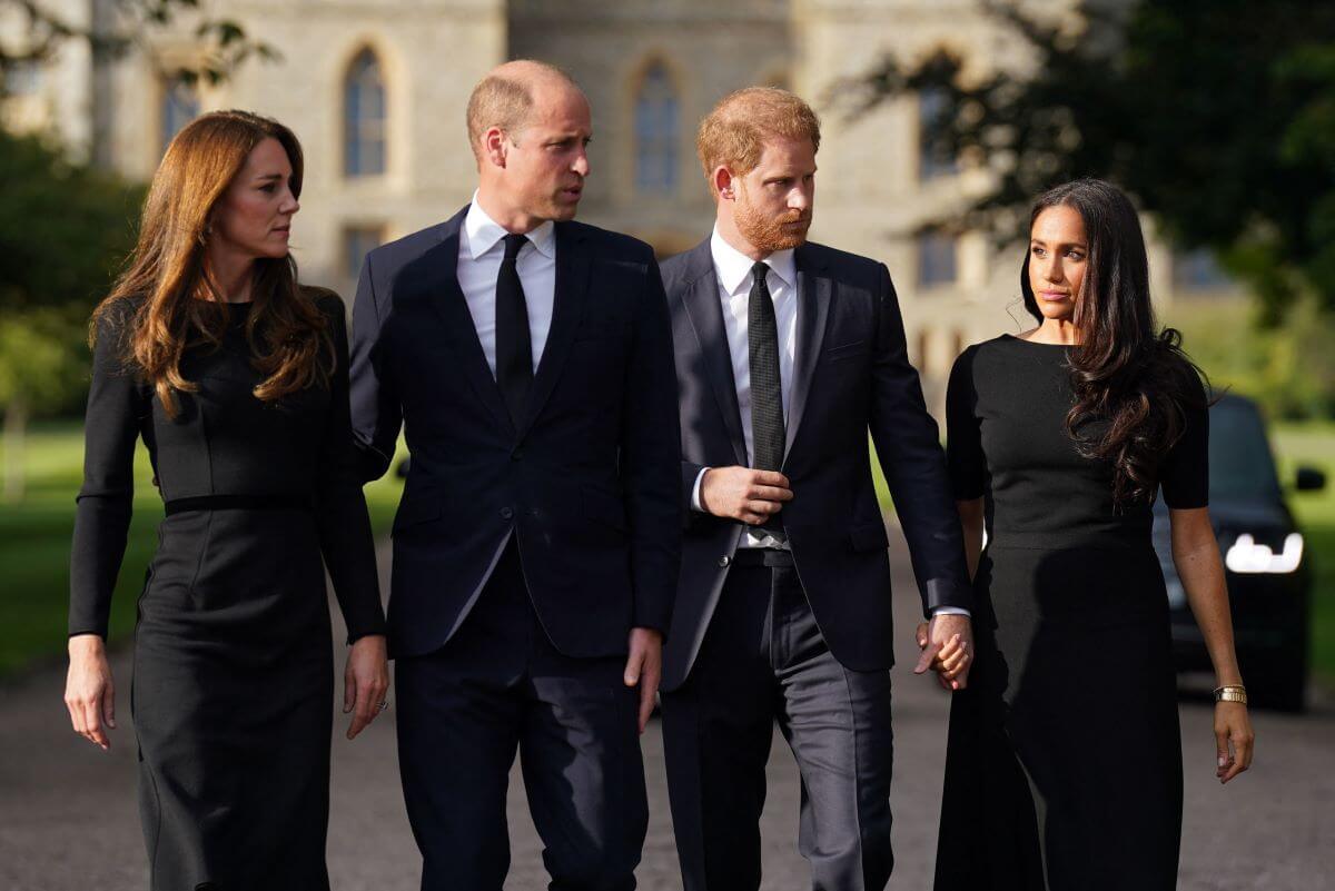 Kate Middleton, Prince William, Prince Harry and Meghan Markle arrive to view floral tributes to Queen Elizabeth II laid outside Windsor Castle