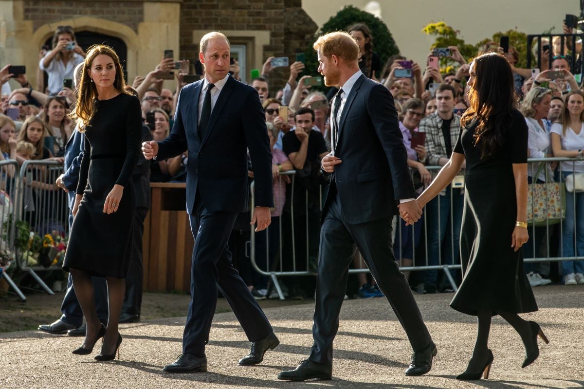 Kate Middleton, Prince William, Prince Harry, and Meghan Markle proceed to greet well-wishers outside Windsor Castle after Queen Elizabeth II's death