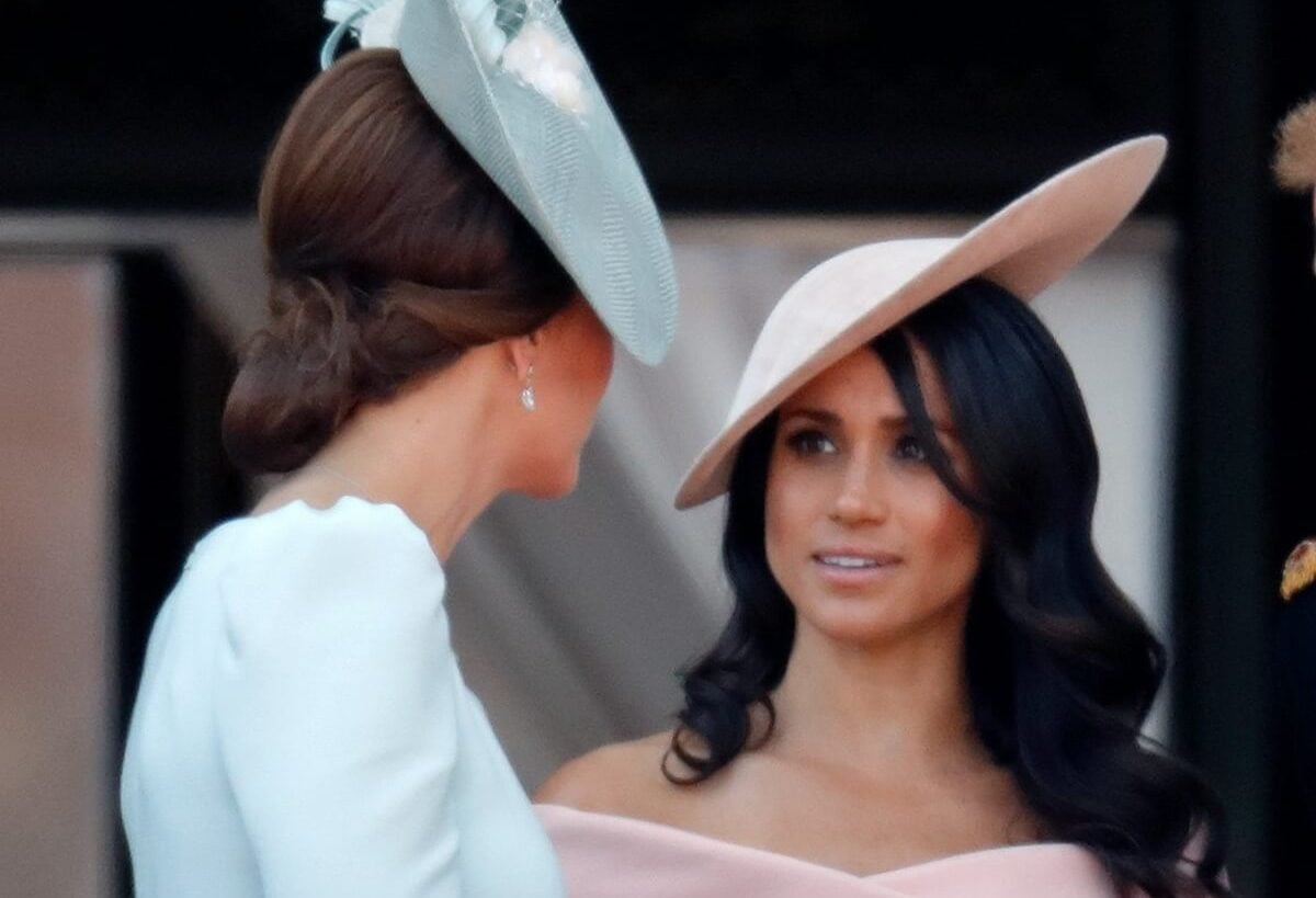 Kate Middleton and Meghan Markle standing on the balcony of Buckingham Palace during Trooping the Colour 2018