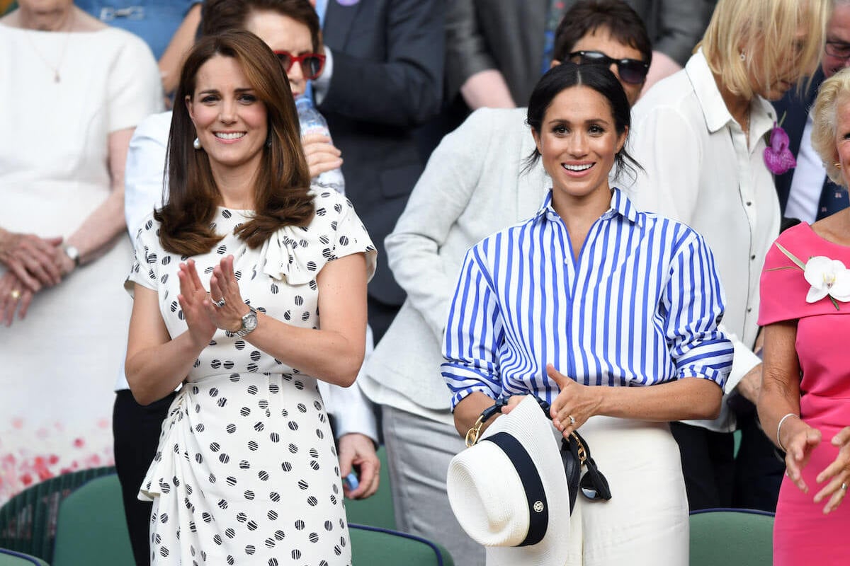 Kate Middleton, who could likely put on a 'more convincing double act' with Meghan Markle years from now, claps along wtih Meghan Markle