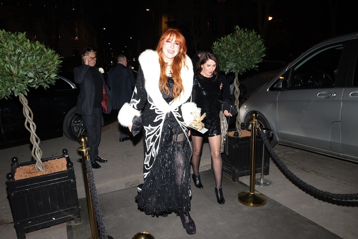 Kate Moss' friend Charlotte Tilbury arriving at her birthday party at the Ritz wearing a black and white fur coat and a black dress.