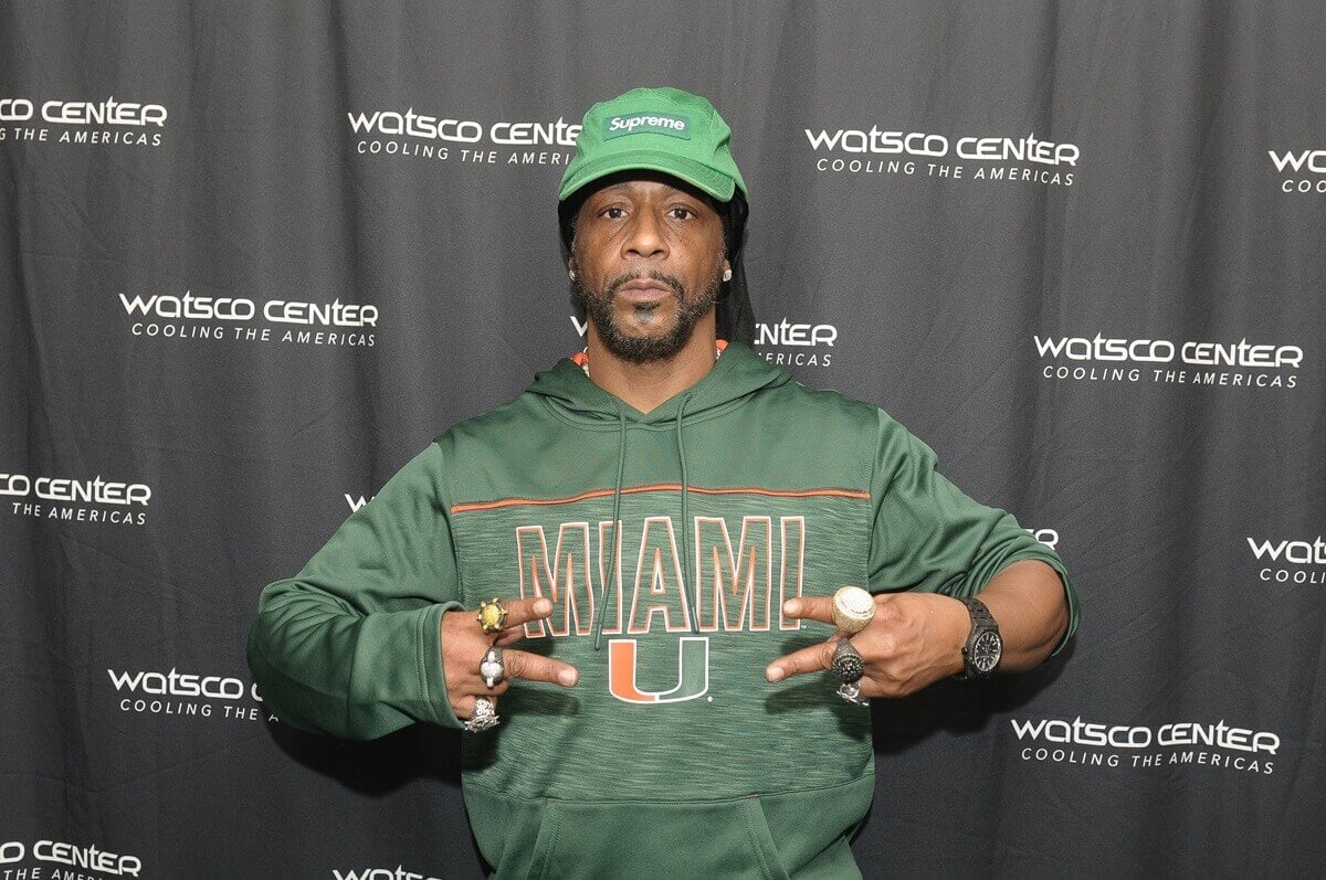 Katt Williams posing in a green outfit for a picture backstage after performing live on stage during the "Katt Williams: The Dark Matter Tour"