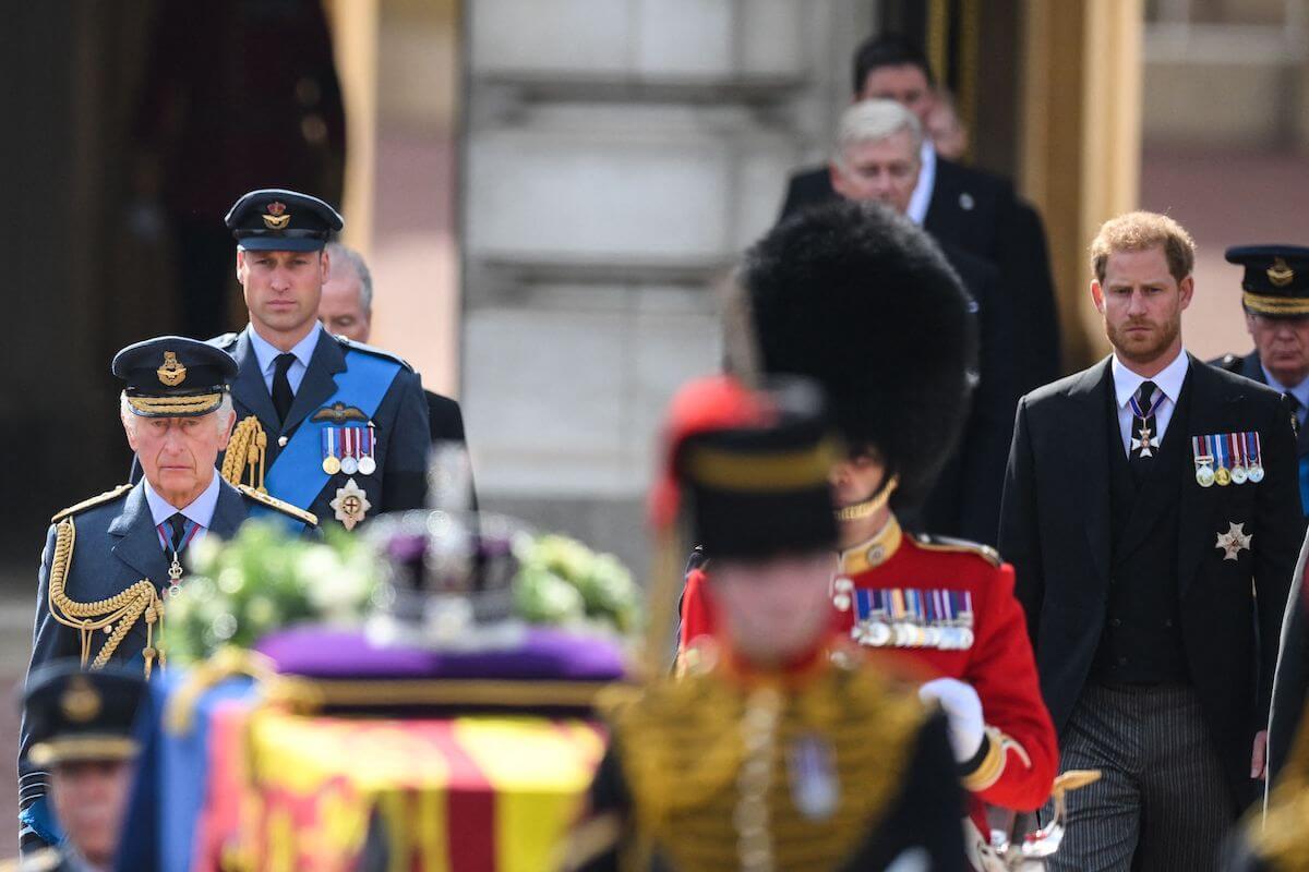 King Charles, Prince William, and Prince Harry, who didn't have dinner together the day Queen Elizabeth II died, walk behind her coffin