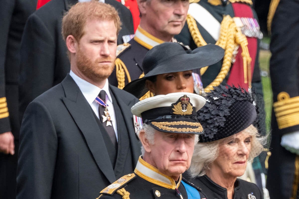 King Charles, who showed Prince Harry and Meghan Markle 'affection' at Queen Elizabeth's funeral with seating arrangement, stands with the couple and Queen Camilla