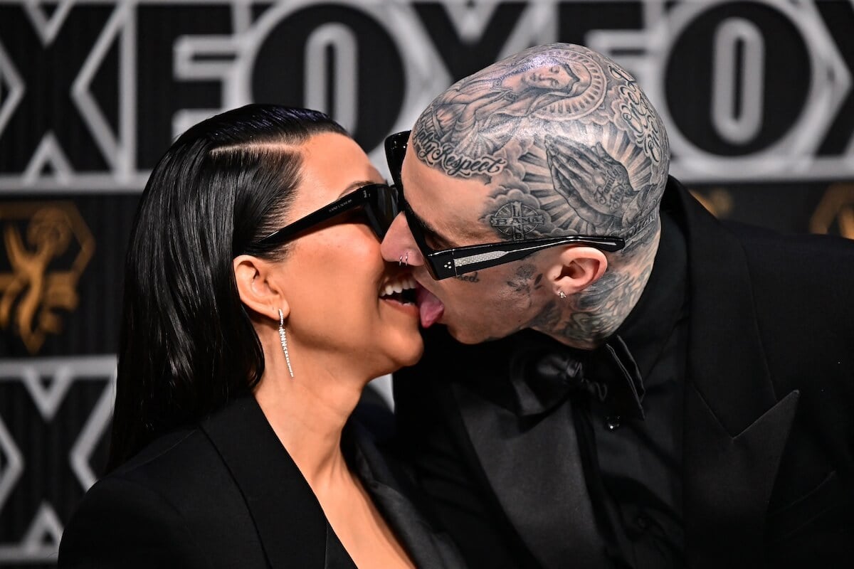 Travis Barker and Kourtney Kardashian kiss on the Emmys red carpet