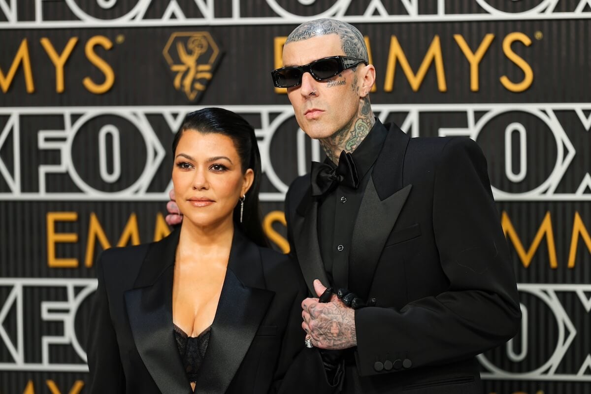 Travis Barker and Kourtney Kardashian holding hands on the Emmys red carpet