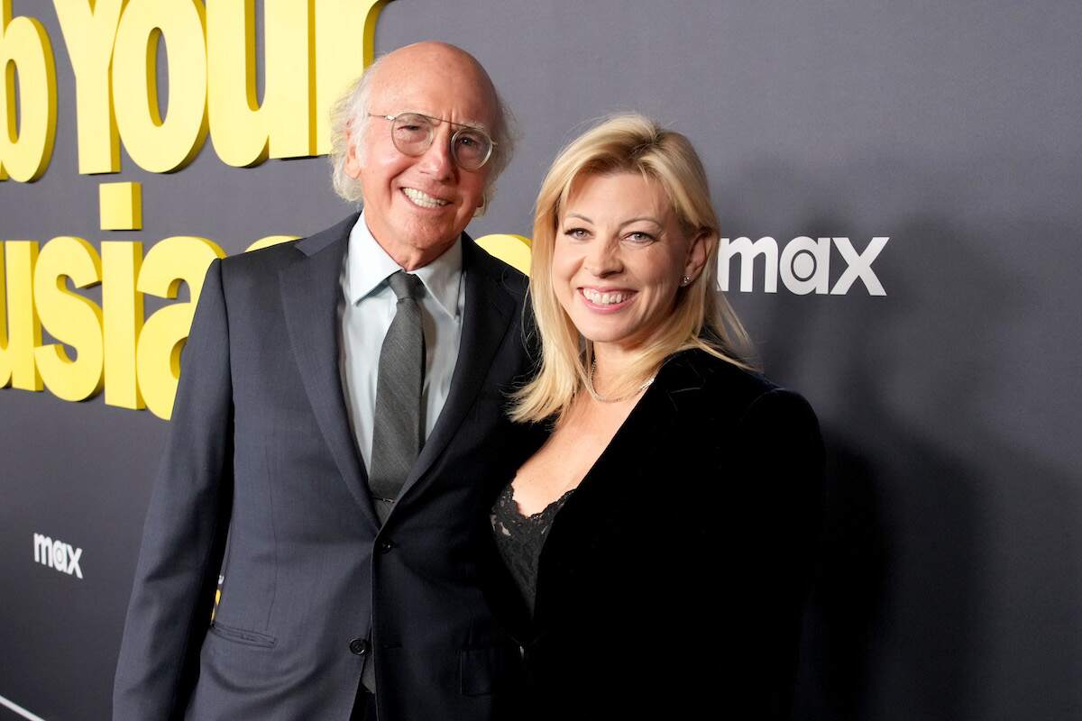Larry David and his wife Ashley Underwood smile together on the red carpet at the Curb Your Enthusiasm Season 12 premiere