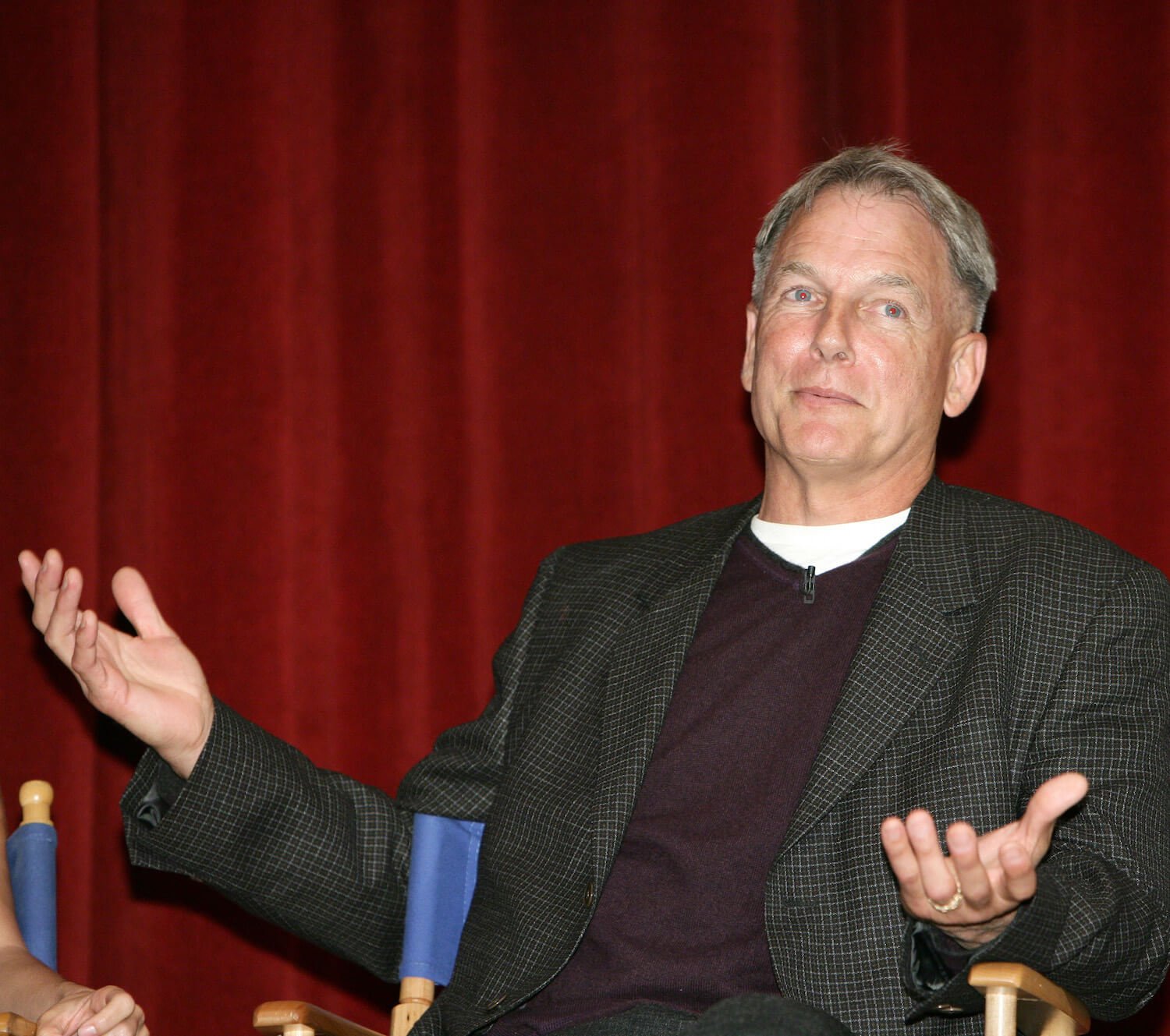 'NCIS' and 'The West Wing' star Mark Harmon sitting down with his hands up by his sides