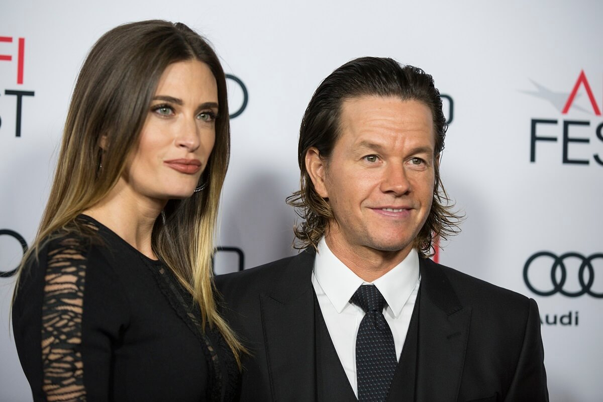 Mark Wahlberg posing next to his wife Rhea Durham at the AFI 2016 Fest presented by AUDI closing night screening of Patriots Day.