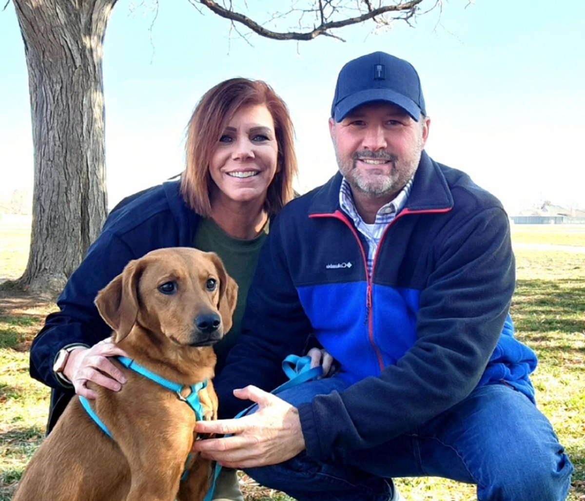Meri Brown is pictured with her rescue dog, Zona and new boyfriend, Amos, in a recent snapshot