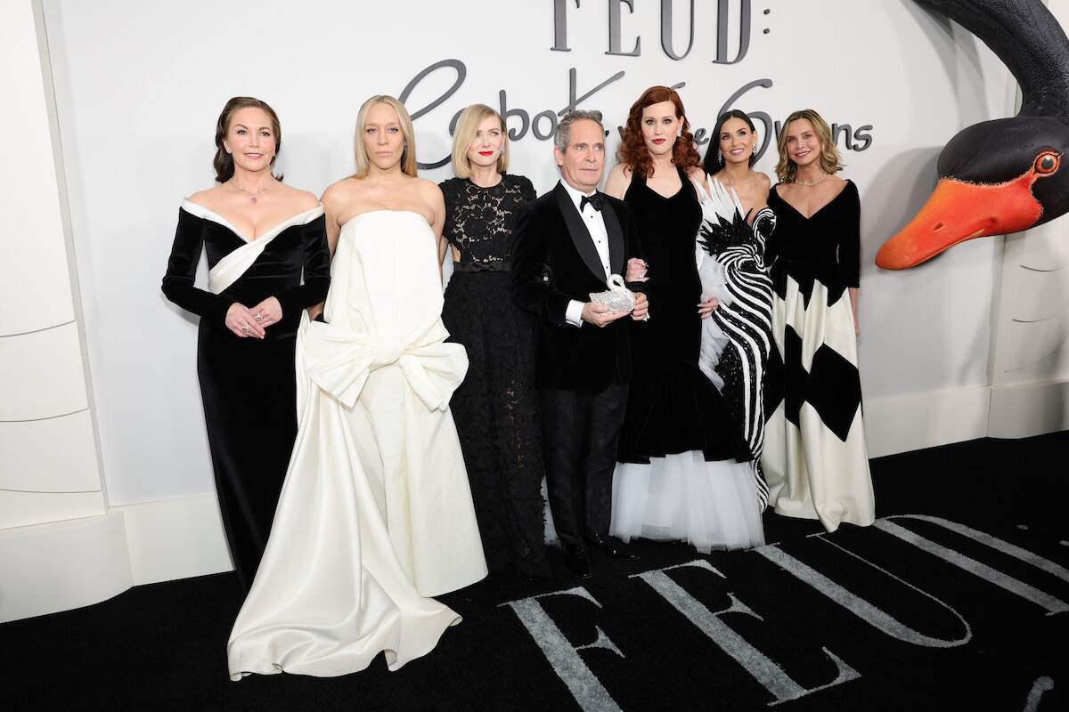 Diane Lane, Chloe Sevigny, Naomi Watts, Tom Hollander, Molly Ringwald, Demi Moore, and Calista Flockhart gather on a black carpet and pose for photos in all black and white outfits