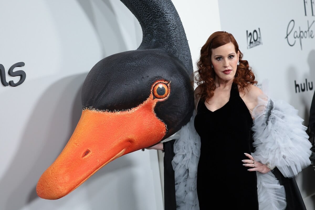 Molly Ringwald poses on the red carpet at the premiere of 'Feud: Capote vs. The Swans'