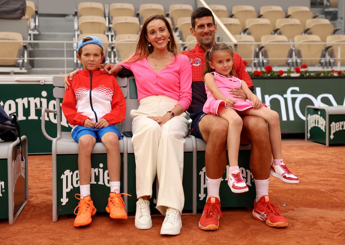 Novak Djokovic, Jelena Djokovic, and their two children pose for a photograph with the winners trophy after the Men's Singles Final match the 2023 French Open